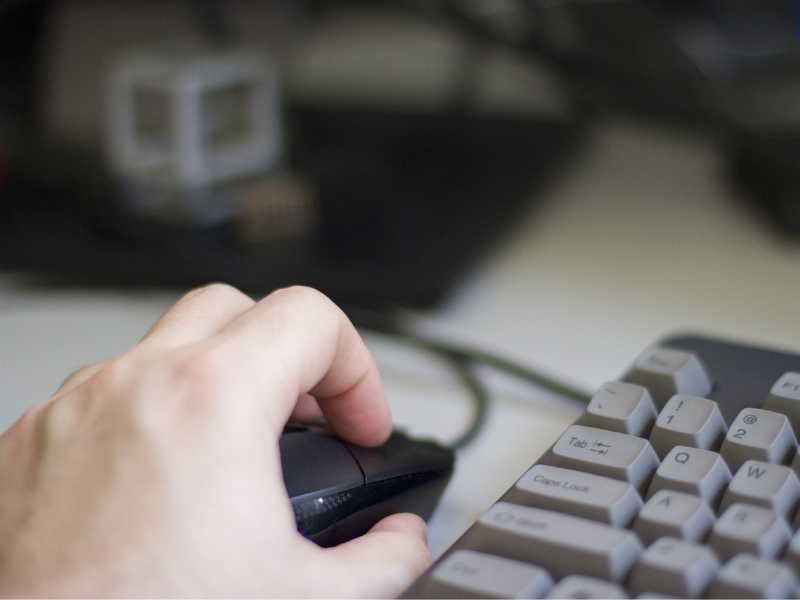 Hand on mouse and keyboard